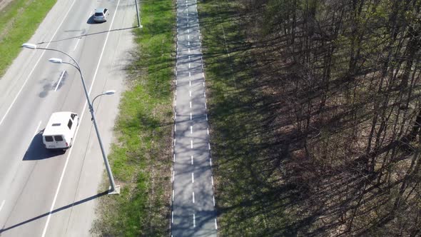 Aerial view on road driveway with bicycle lane