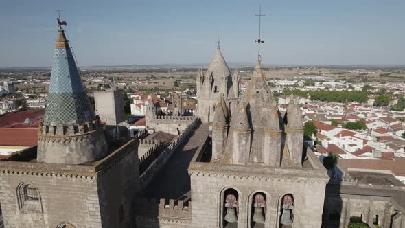 Aerial orbiting over Evora cathedral Towers, ancient Landmark, Alentejo