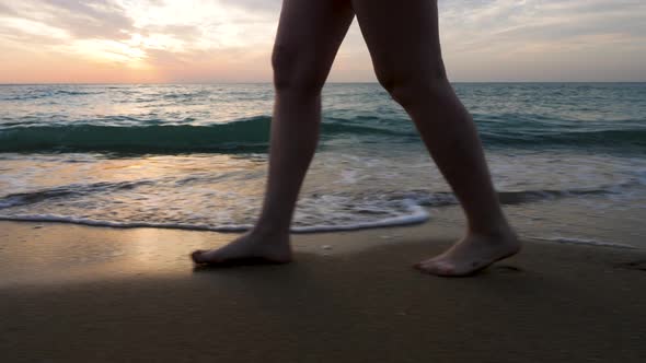 Close Up Woman Feet Walking on the Beach in the Water alt