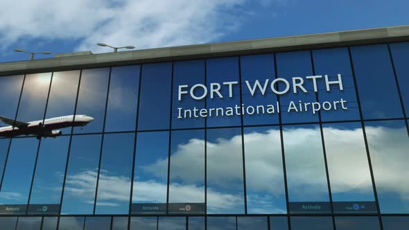 Airplane landing at Fort Worth, Dallas Texas, USA airport mirrored in terminal alt