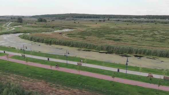 Woman is cycling on aero bicycle. Hard workout. Triathlete is training and doing cardio exercises alt