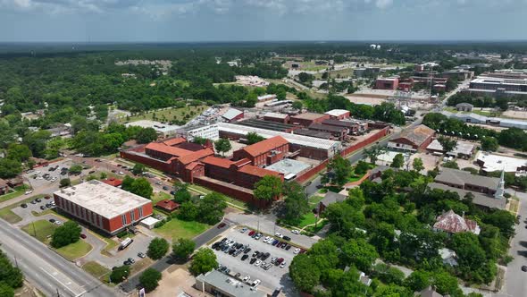 Texas State Penitentiary at Huntsville. Walls Unit in TX prison system. Aerial orbit. Electrocution alt