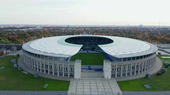 Berlin, Germany Soccer Football Stadium Establishing Shot, Slow Aerial Slide Right on Beautiful Day alt