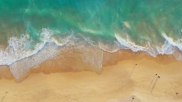 Aerial Top View Waves Crashing Along The Beach alt