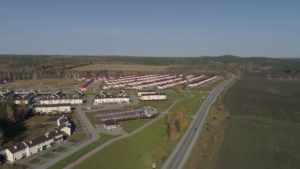 Aerial view of cottage village with identical houses 02 alt