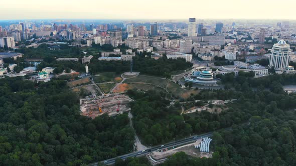 Drone Fly Above Green Nature in Big European City at Summer Sunset alt