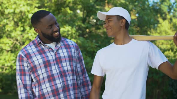 Dad Encouraging Son Holding Baseball Bat, Sport Leisure, Family Connection Hobby alt