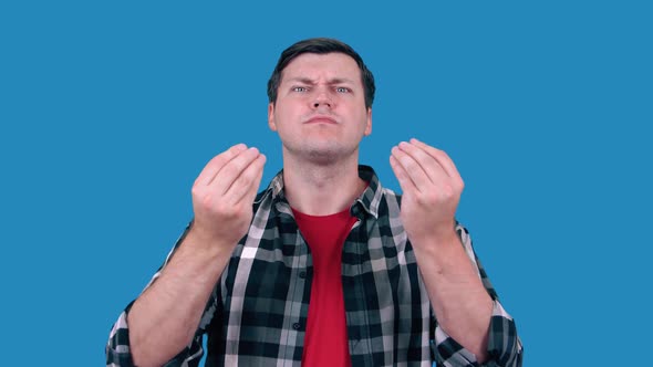 A Man in a Shirt Talks and Gestures Like an Italian on a Blue Background