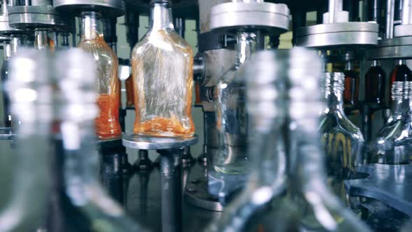 Factory Transporter Is Filling Bottles with Alcohol alt