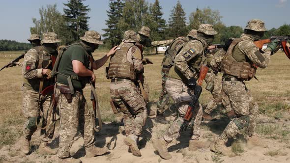 In Battlefield Soldiers with Weapons and Ammunition is Attacking Enemy Military Special Forces alt