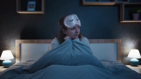 Sad Tired Woman Puts on a Sleep Mask and Falls Asleep Falls Asleep After a Hard Day