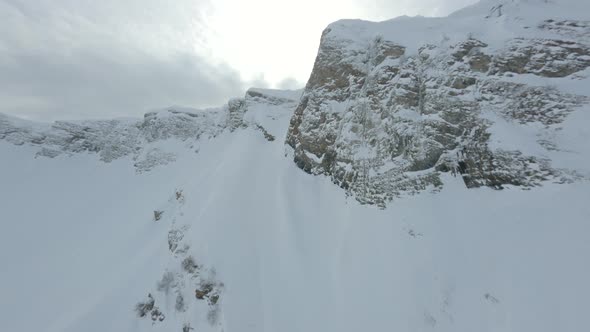 Aerial View Sports FPV Drone Speed Dive Wallride From Cliff Peak Down alt
