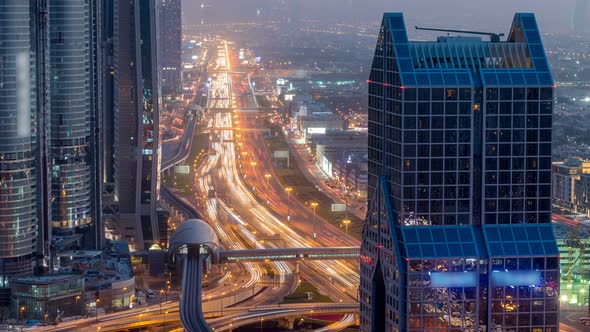 Dubai Downtown Skyline Day to Night Timelapse and Sheikh Zayed Road Traffic UAE alt