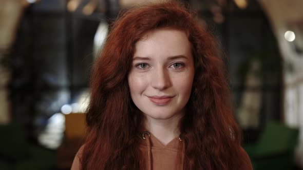 Crop View of Cheerful Red Haired Woman Smiling and Looking to Camera alt