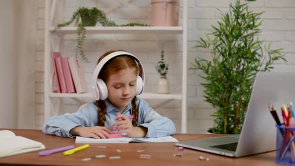 Little Child Girl Using Laptop Computer for Studying Online E-learning System