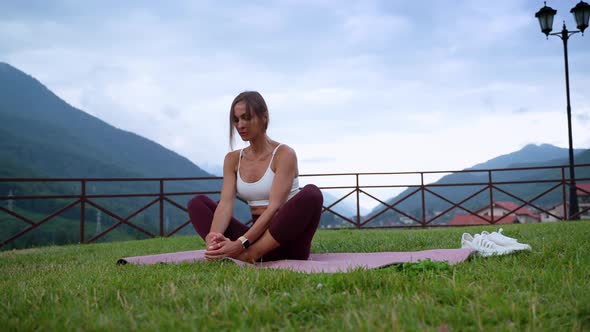 Yoga Practice for Health and Flexible Body Woman is Stretching Legs Retreat Practicing alt