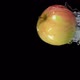 An Apple is Bouncing Horizontally From Water with Splashes on a Black Background - VideoHive Item for Sale