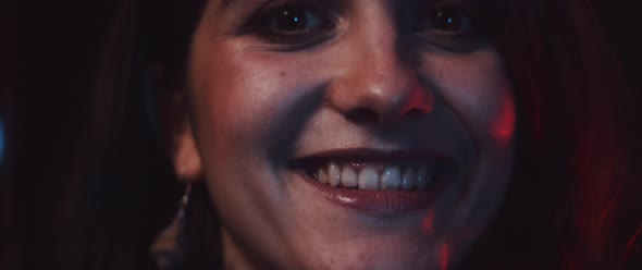 Photographer taking a picture, smiling and nodding alt