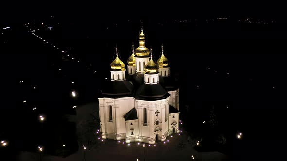 Orthodox Church With Golden Domes at Night alt