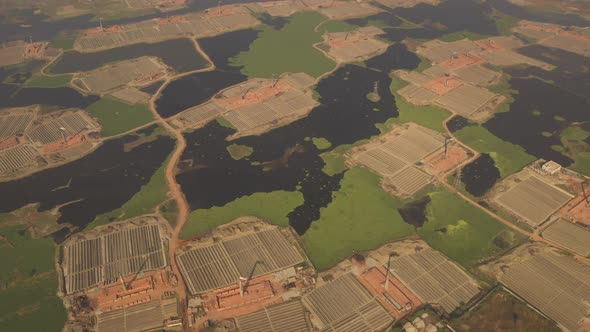 Aerial view of chimneys kilns from brick factory, Dhaka, Bangladesh. alt