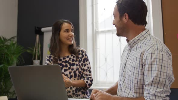 Millennial creative professionals working in a creative office alt