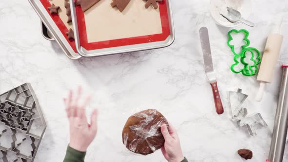 Flat lay. Step by step. Rolling out gingerbread cookie dough to bake Christmas cookies. alt