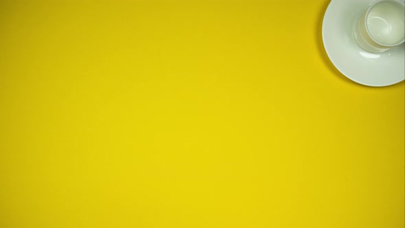 Yellow Background With Coffee Cup And Protecting Mask. Stop Motion Animation alt
