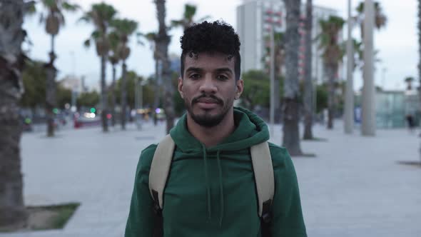 Portrait of Young Beautiful Hispanic Man Smiling Looking at Camera alt