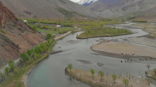 Aerial View Over Riverbend Of Ghizer River With Valley Landscape In The Background In Pakistan alt