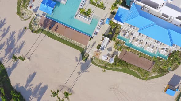 Aerial top down shot of luxury Hotel Resort with pools,palm trees and private beach - Sensatori cap alt