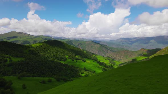 Picturesque Landscape of Emerald Green Hills on Sunny Day