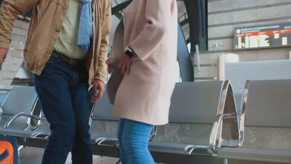 Senior Couple Waiting for Their Flight in an Airport alt