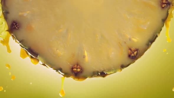 Flowing Pineapple Juice From Pineapple Slice Macro Shot in Slow Motion alt