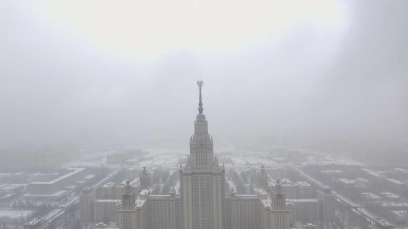 Aerial footage of stalin building Moscow State University in winter cloudy and snowy weather