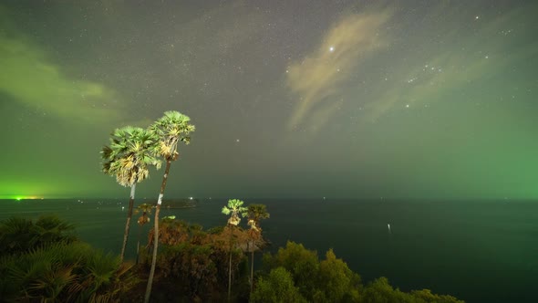 Time lapse of Promthep Cape viewpoint at night with stars and space in Phuket,Thailand. alt