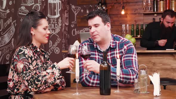 Couple Enjoying a Romantic Night in Vintage Restaurant alt