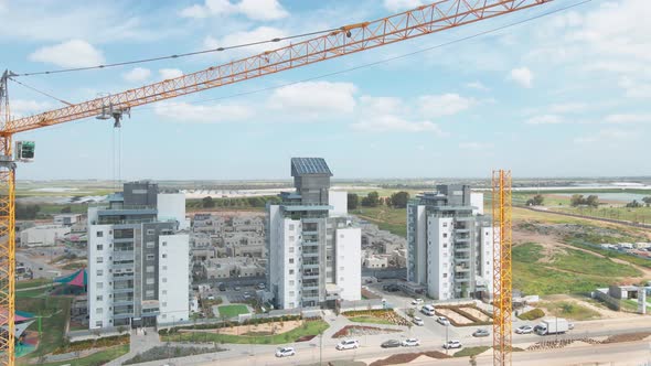 new neighborhood buildings with cranes at southern district city netivot at the state of israel alt