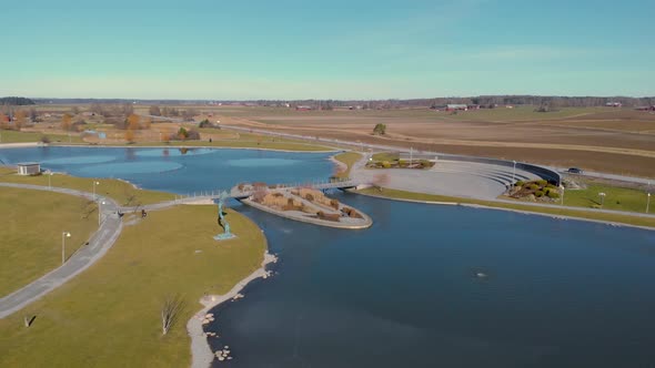 Dji drone flying fast over artificial lake alt