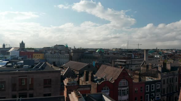 Low Flight Above Roofs of Old Brick Houses in City Centre alt