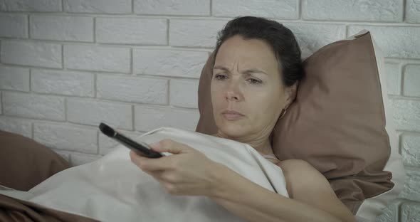 Asleep watching television.  alt