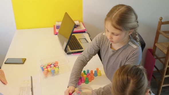 Children playing at desk