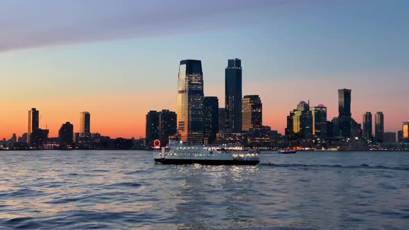 Statue Cruises Ferry at Sunset Hoboken Skyline alt