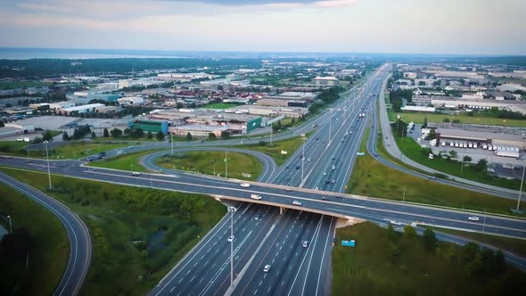 Aerial shot of a bustling city highway. alt
