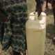 African mother collecting water with her children - VideoHive Item for Sale