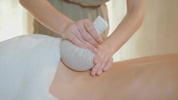 Thai massage. Massage for health. Woman having massage in spa salon. Back massage. alt