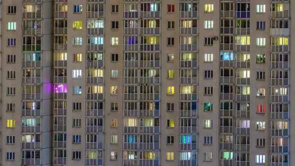 windows of residential buildings timelapse. light in the windows of apartments and apartments. alt