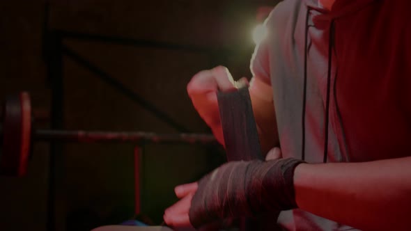 Man Get Ready for Boxing Training in the Locker Room alt