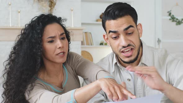 Hispanic Couple Sits at Home on Couch Hold Papers Receive Divorce Documents Letter with Bad News alt