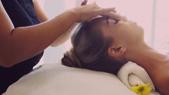Woman Gets Facial and Head Massage in Luxury Spa alt