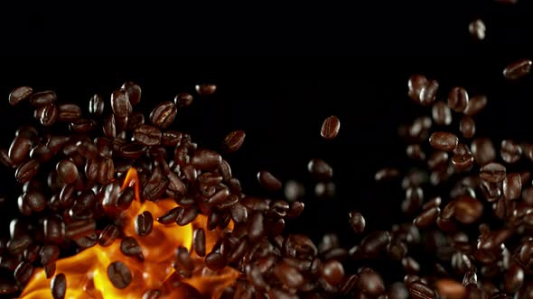 Super Slow Motion Shot of Flames and Coffee Beans Explosion on Black Background at 1000Fps alt